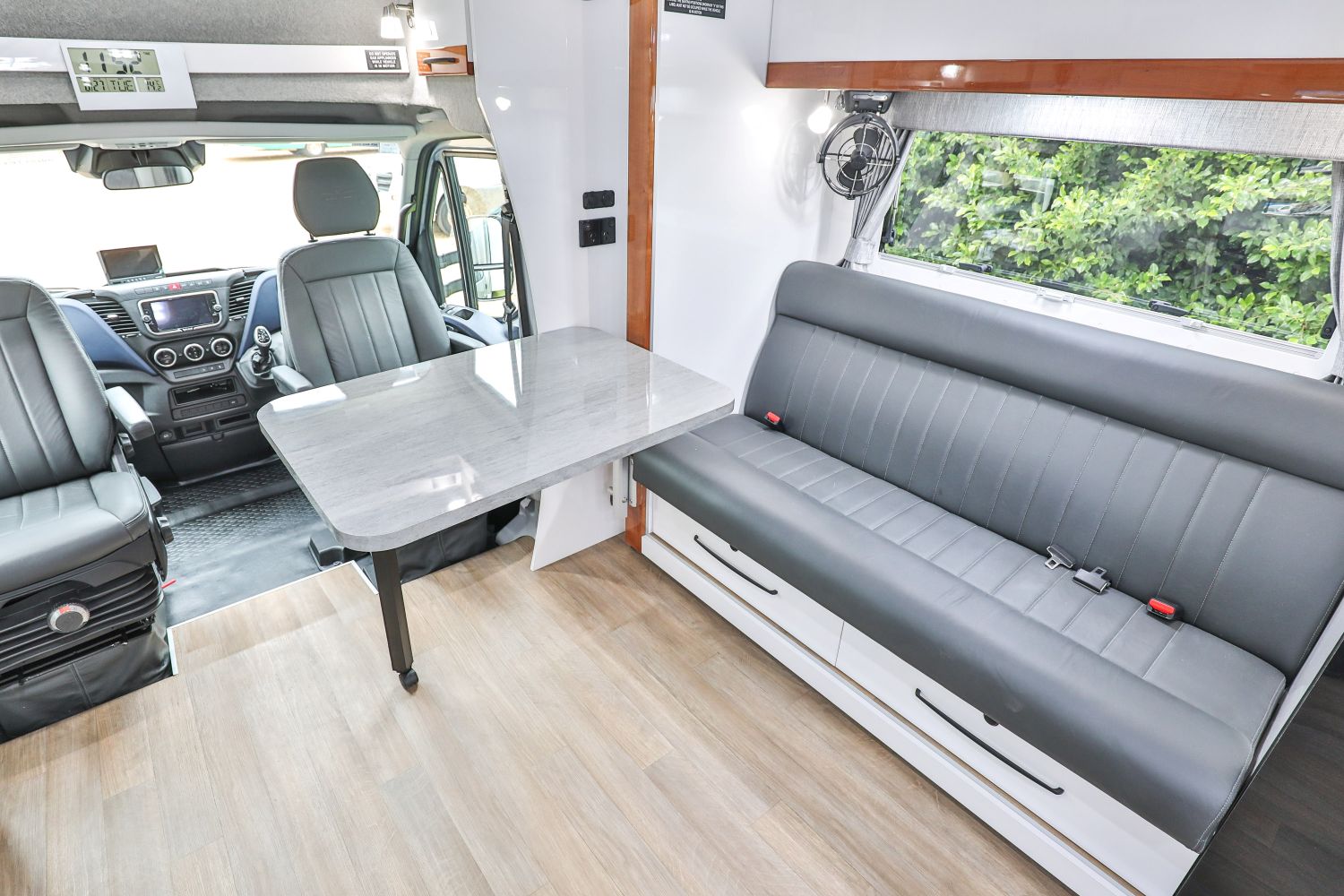 Lounge seat and swivel seats with fold out table